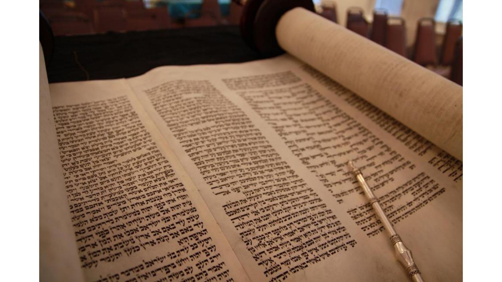 A handwritten Torah scroll